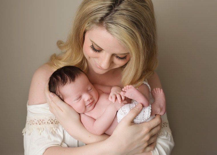 Baby poses in military uniform of father she'll never meet