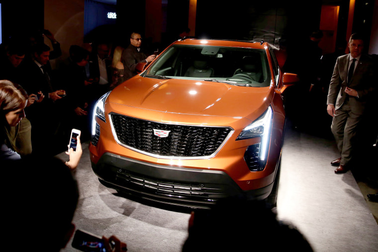 Image: Visitors take photos after Cadillac unveils the new XT4 SUV in advance of the New York Auto Show in the Manhattan borough of New York City