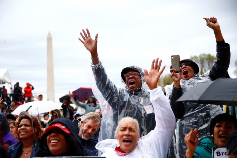 Image: Attendees are seen during a march and rally on the National Mall to mark the 50th anniversary of the assassination of civil rights leader Martin Luther King Jr. in Washington
