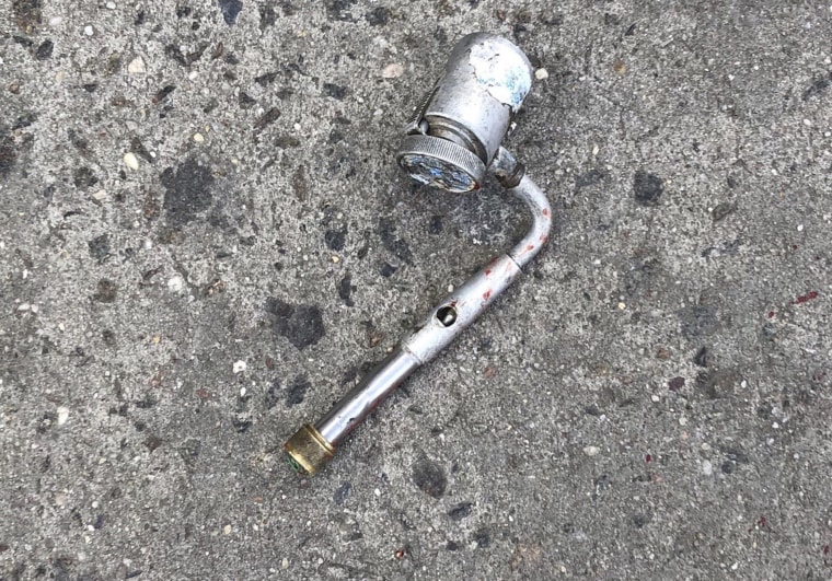Image: A metal object at the scene where police officers fatally shot a man who was reported to be threatening people with a gun