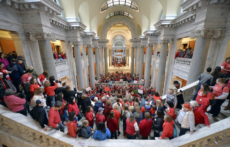 Thousands of teachers from across Kentucky fill the state Capitol to rally for increased funding and to protest last minute changes to their state funded pension system in Frankfort, Kentucky on April 2. This was one of several demonstrations, to include thousands more that filled the state Capitol in Oklahoma, as schools closed and educators called for increased education funding.