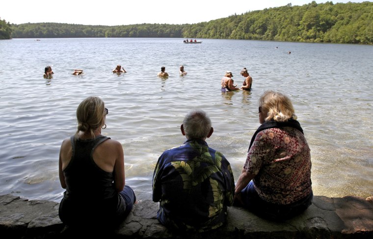 Swimmers enjoy an afternoon at Walden Pond in Concord, Massachusetts.