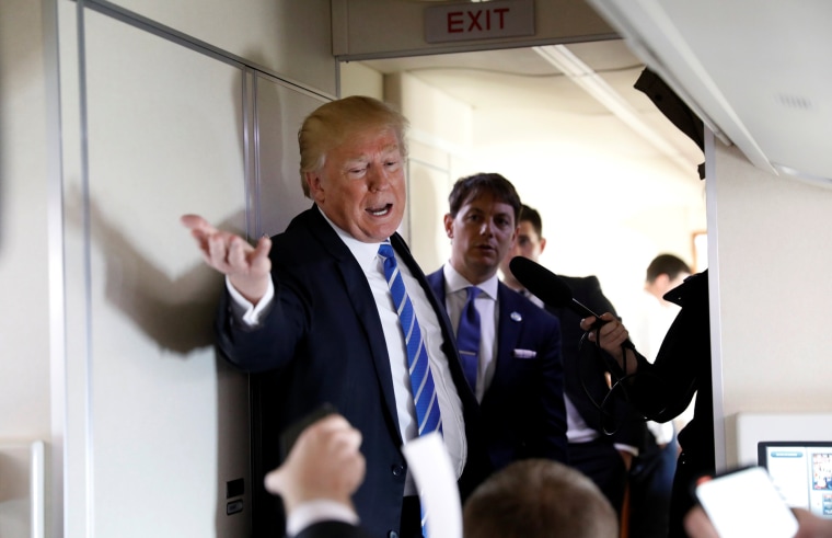 Image: President Donald Trump speaks aboard Air Force One