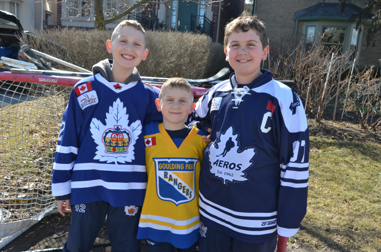 Kristi Ashcroft's 11-year-old son, Jake, pictured on the right next to brothers Connor, 7, in the middle and Charlie, 10 on the left, wanted to their family to participate in the #putyoursticksout movement to support the victims and families of the Humboldt Broncos junior hockey team.