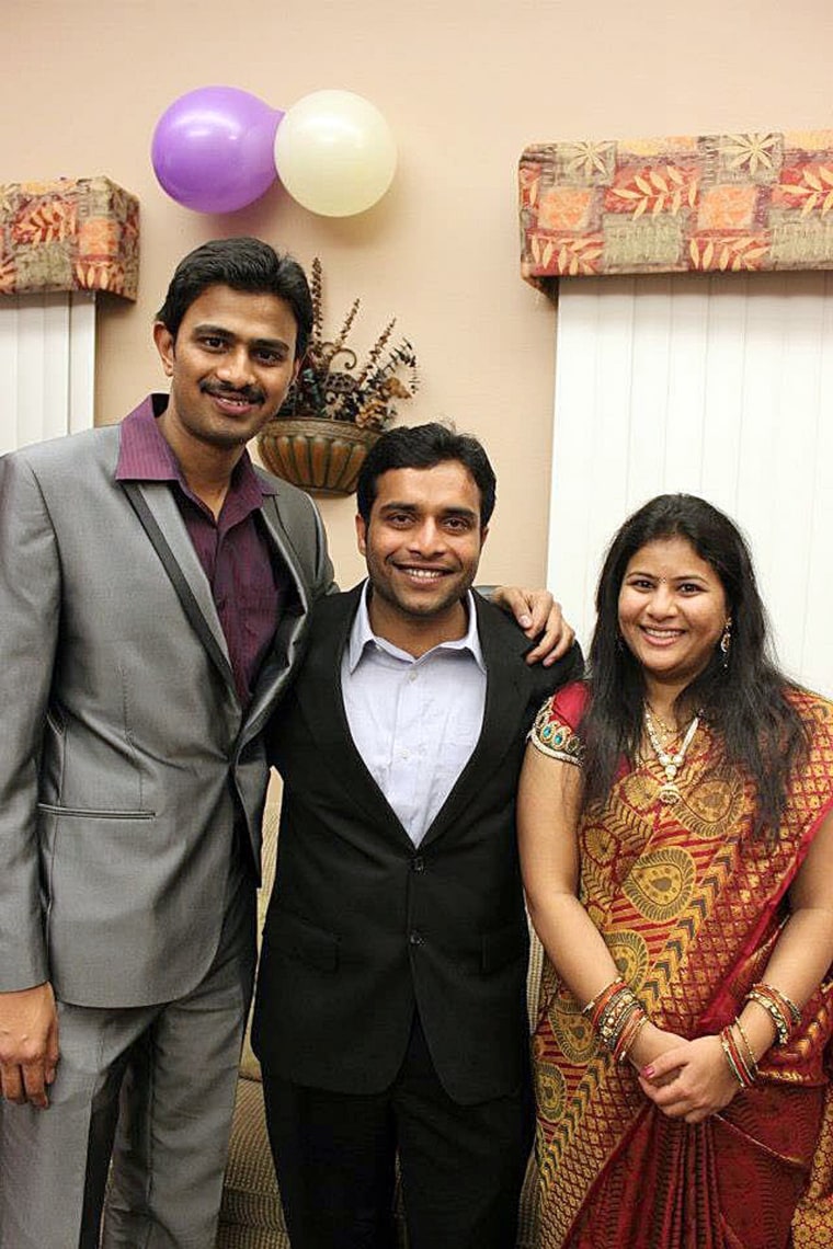 Image: Srinivas Kuchibhotla, left, poses for photo with Alok Madasani and his wife Sunayana Dumala in Cedar Rapids, Iowa.