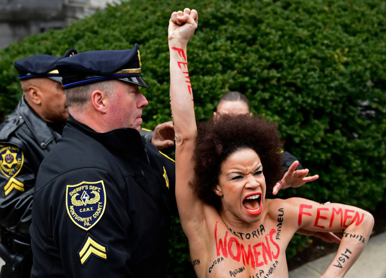 Image: Protester outside Bill Cosby trial