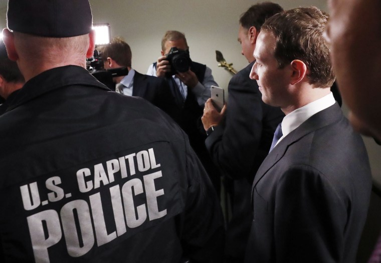 Image: Mark Zuckerberg walks to meetings on Capitol Hill in Washington