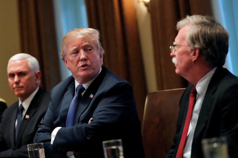 Image: Donald Trump receives a briefing from senior military leadership accompanied by Vice President Mike Pence and new National Security Adviser John Bolton in Washington, DC