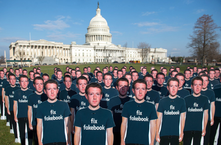 Image: One hundred cardboard cutouts Mark Zuckerberg stand outside the U.S. Capitol