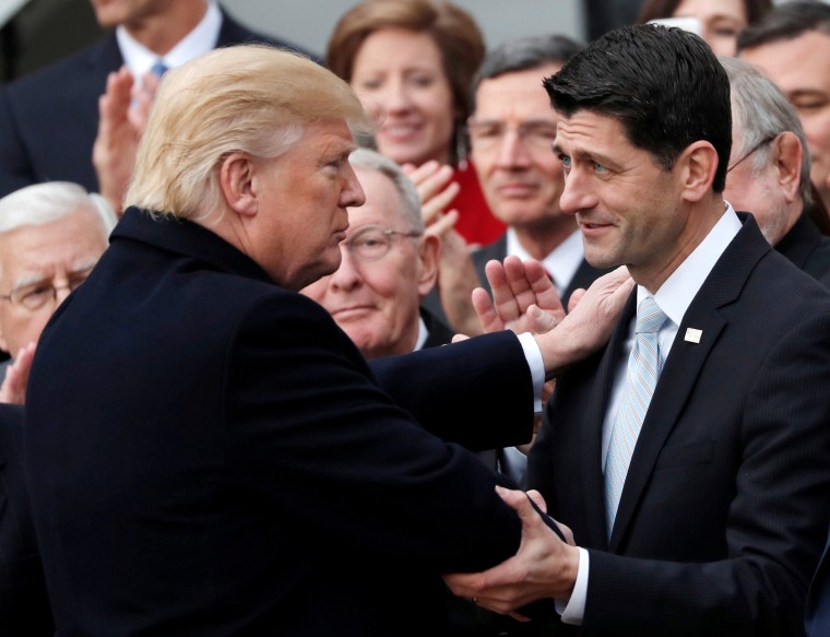 Image: Trump shakes hands with Speaker of the House Paul Ryan on the South Lawn of the White House in Washington