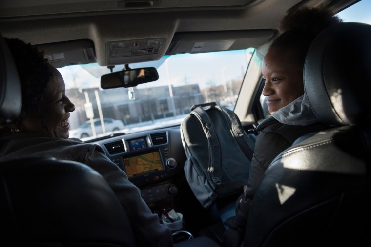 Image: Lowell High School junior Moureen Mathenge rides home with her mother