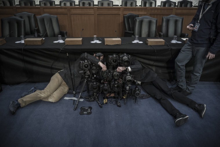 Image:  News photographers prepare remote cameras