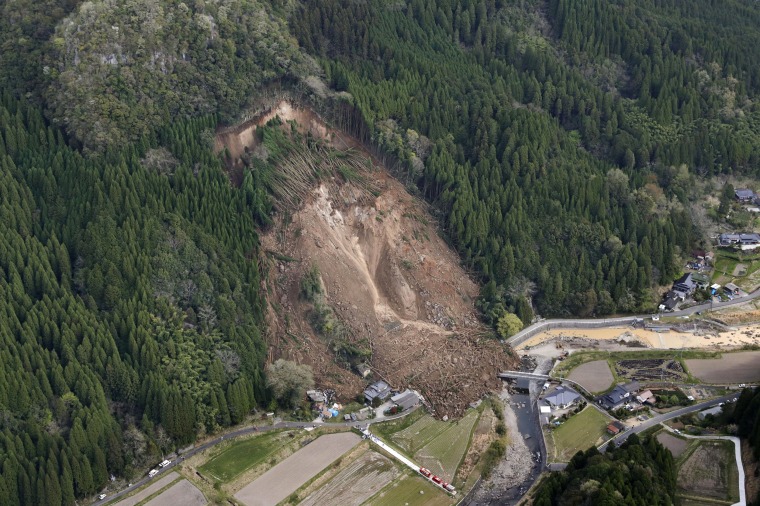 Image: A landslide early on April 11 buried homes and left six missing in Nakatsu, Japan
