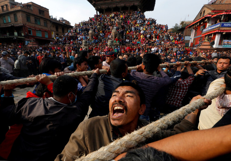 Image: Devotees pull the chariot of God Bhairab during the Biska Festival also known as Bisket Festival in Bhaktapur