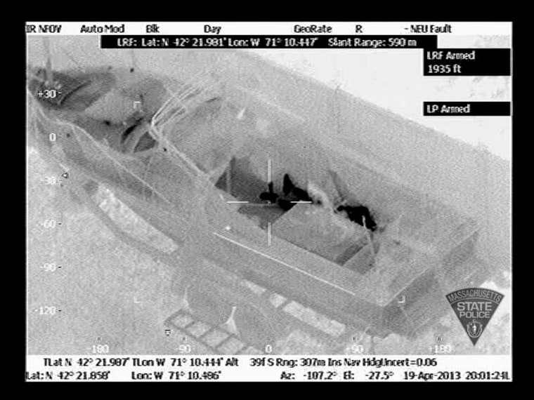 Image: Handout of an aerial infrared image showing the outline of Dzhokhar Tsarnaev in a boat