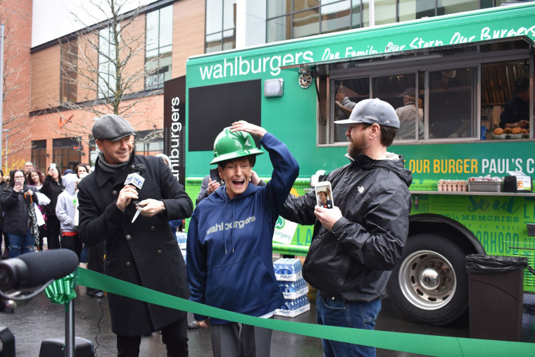 Members of the Wahlberg family cut the ribbon at their hometown food truck.