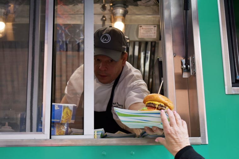 Paul Wahlberg serves customers from Boston food truck.