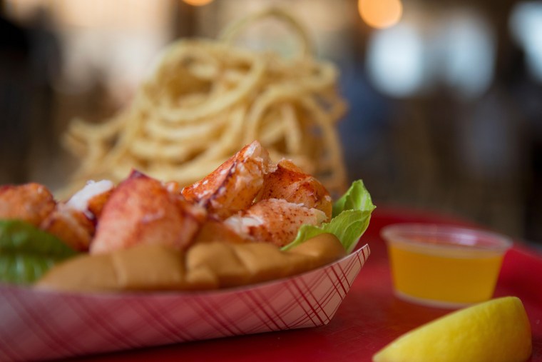 Cold lobster roll and onion rings at Arnold's Lobster and Clam Bar.