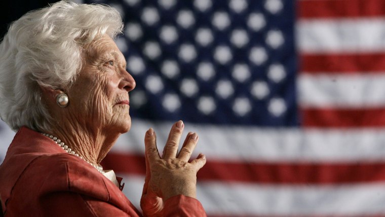 Former U.S. first lady Barbara Bush listens to her son, President George W. Bush, as he speaks at an event on social security reform in Orlando