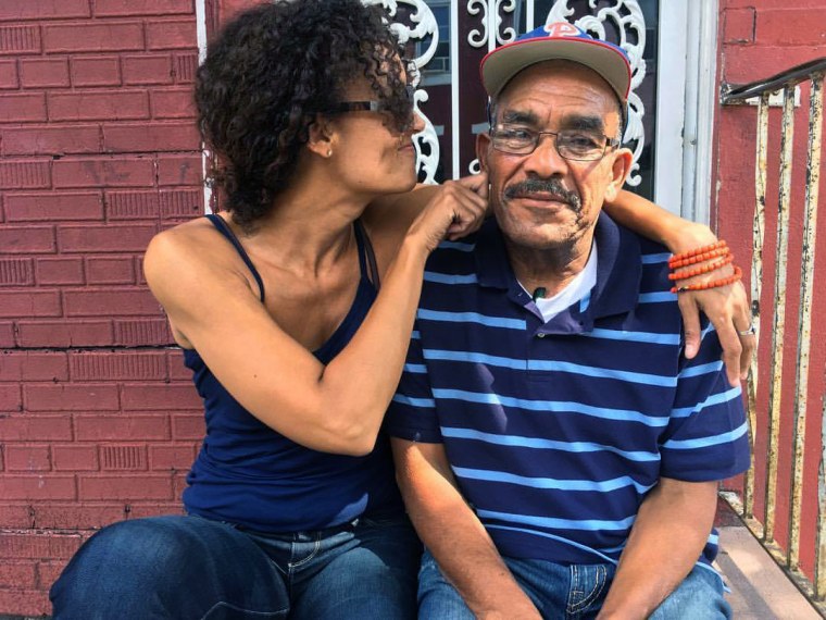 Image: Wanda Benvenutti sits with her father in front of her aunt's house in Philadelphia