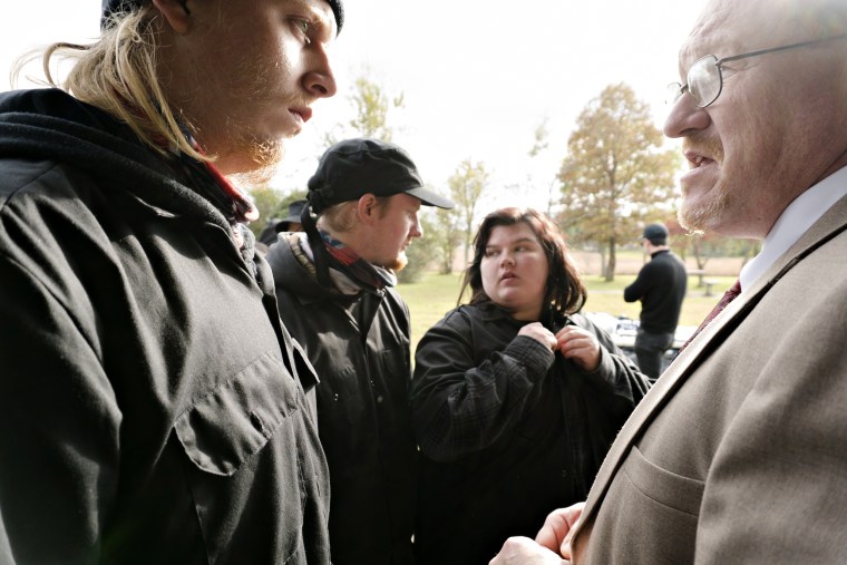 Zach "Rhino" Taylor, left, speaking with Scott Goodwin, right, father of white racial activist Jacob Goodwin at the rally in Tennessee.