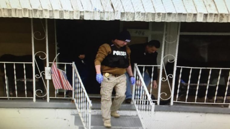 Image: Police during a raid in Huntington, West Virginia
