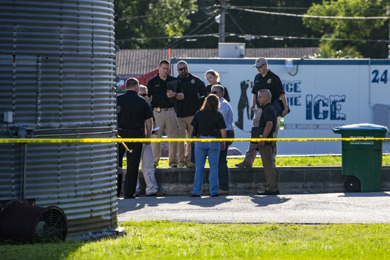 Image: Police gather across the street from Ace China in Trenton where they are investigating a shooting in Trenton, Florida, April 19, 2018.