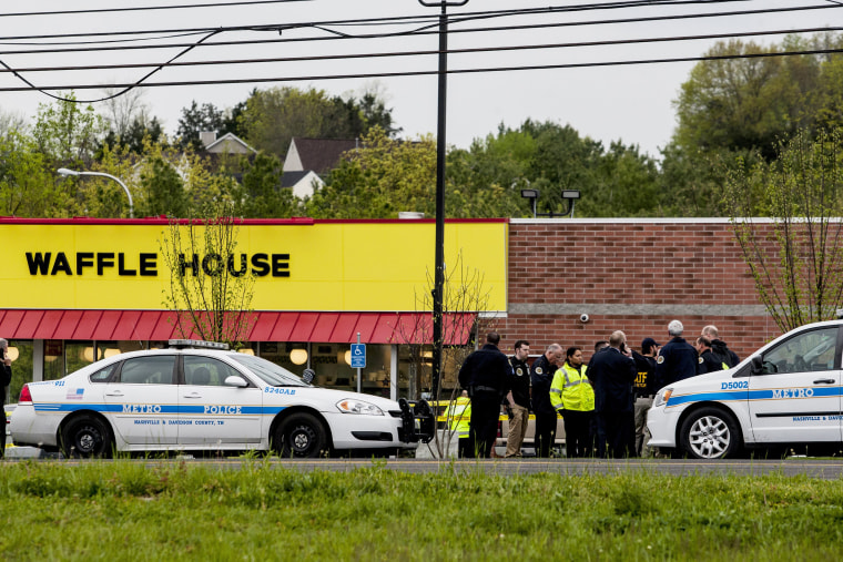 Image: Officials investigate the scene of a shooting at a Waffle House restaurant