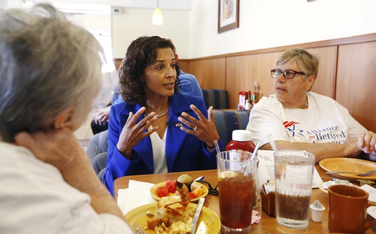 Image: Dr. Hiral Tipirneni speaks with supporters