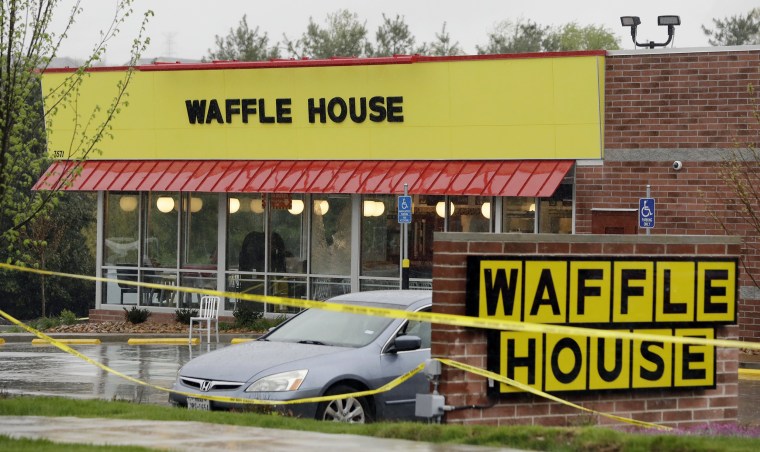 Image: Police tape blocks off a Waffle House restaurant