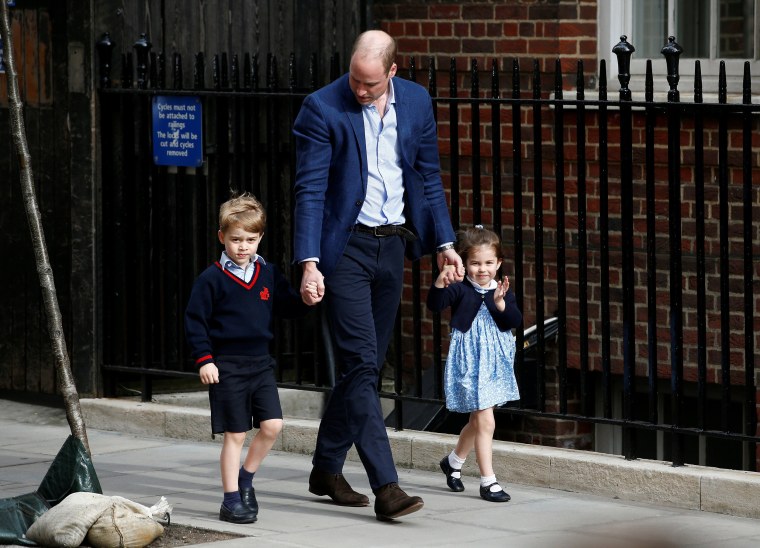 Image: Britain's Prince William with his children Prince George and Princess Charlotte
