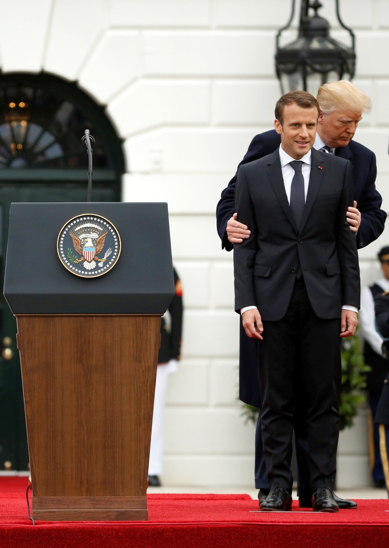 Image: U.S. President Donald Trump and first lady Melania Trump welcome French President Emmanuel Macron and his wife Brigitte Macron during an arrival ceremony at the White House in Washington