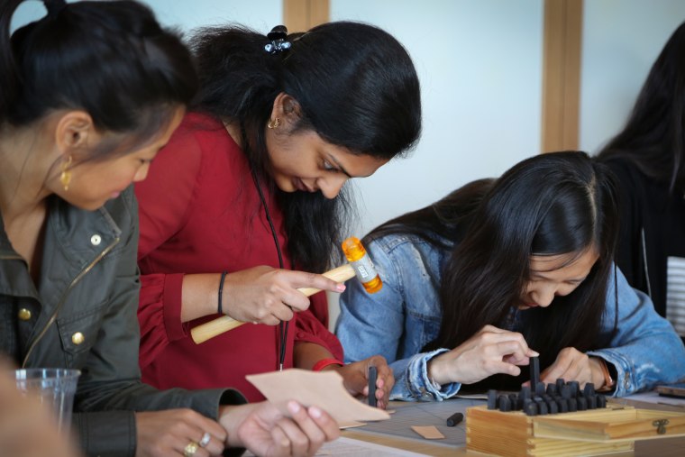 After attending Knit Con for the last two years, Pinterest product designer Cheryl Chepusova (not pictured) wanted to channel her passion for leatherworking by teaching a course in making monogrammed wallets. "It's very different from my day job," said Chepusova. "When I'm working, it's very precise, whereas this is very organic, a craft, with malleable fabric."