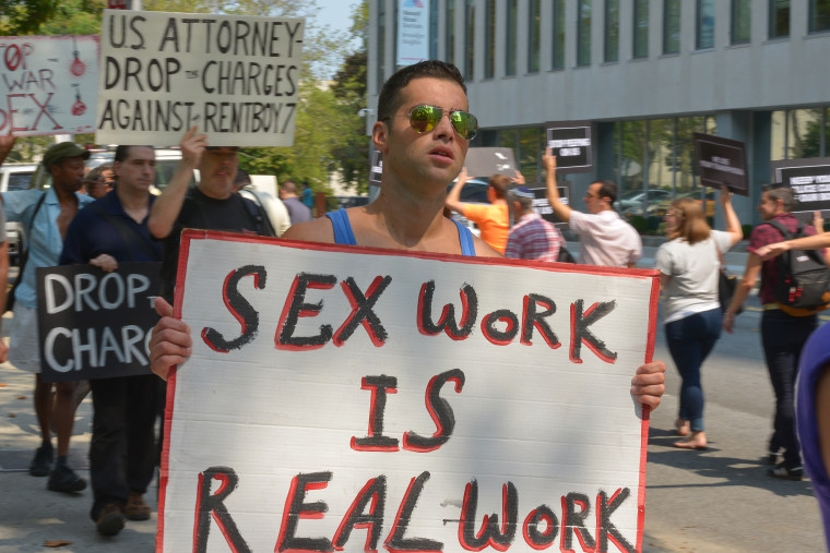 Image: A demonstrator protests the shutdown of Rentboy.com.