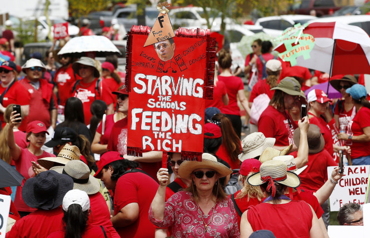 Image: Thousands participate in a protest at the Arizona Capitol for higher teacher pay and school funding on the first day of a state-wide teachers strike on April 26, 2018, in Phoenix.