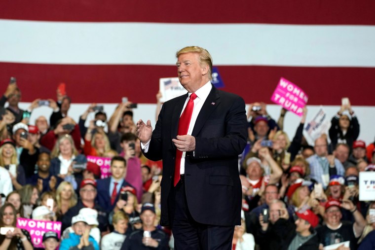 Image: U.S. President Donald Trump speaks at a Make America Great Again Rally in Washington, Michigan