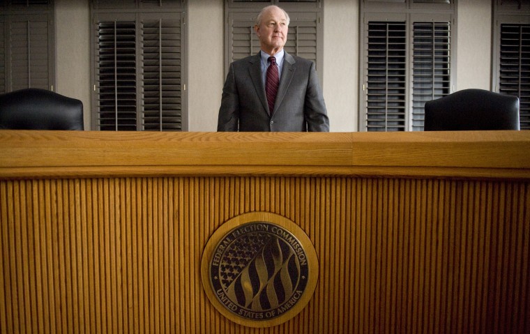 Imaeg: Federal Election Commission's Steven Walther poses in the FEC's hearing room