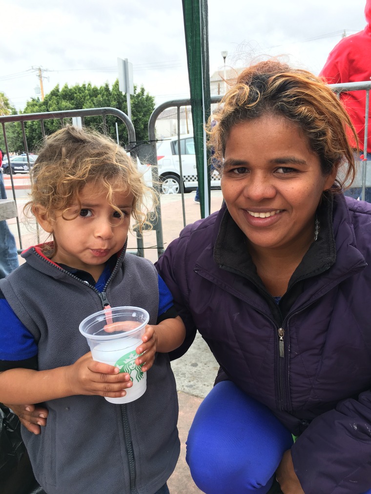 Image: Wendi Garcia and her son Oscar, migrants apart of the caravan waiting to seek asylum in the U.S., currently outside the San Ysidro port of entry.