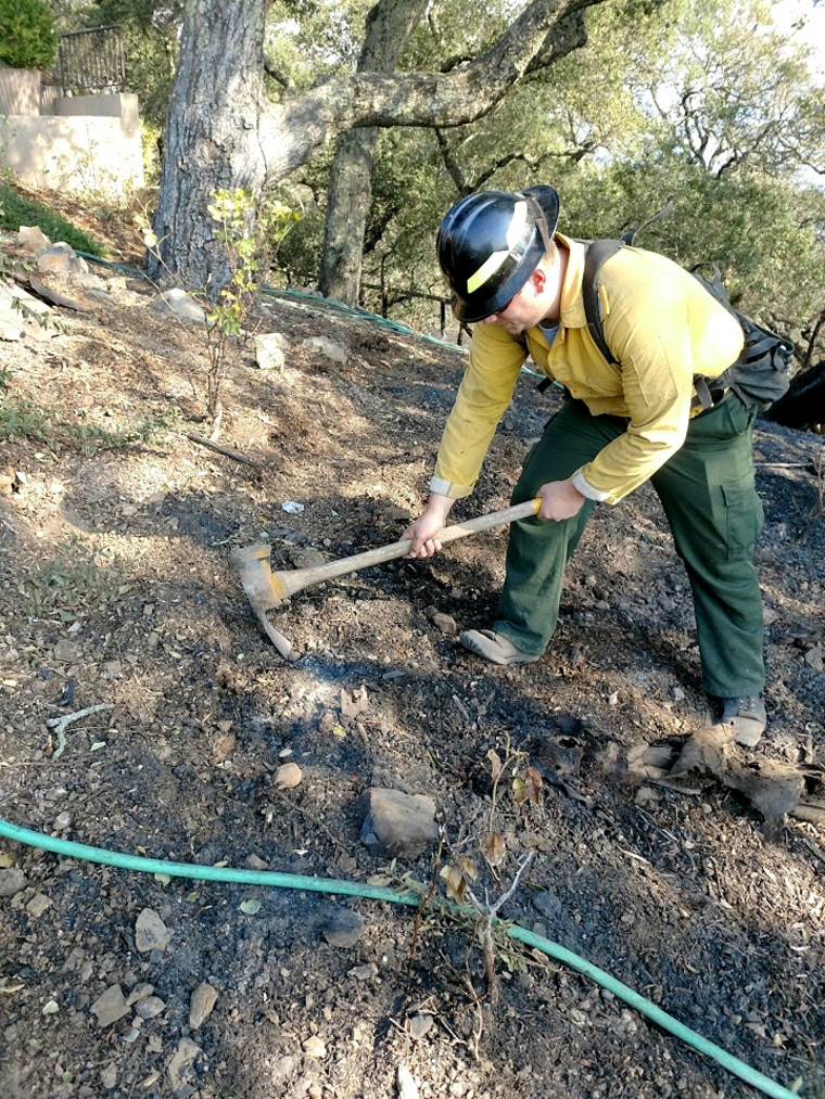 Image: Wildfire Defense Services firefighters dig up hotspots near the home of Fred Giuffrida and Pamela Joyner in Sonoma, California in Oct. 2017.