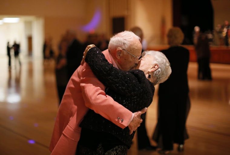 Image: A couple kisses at the end of a dance