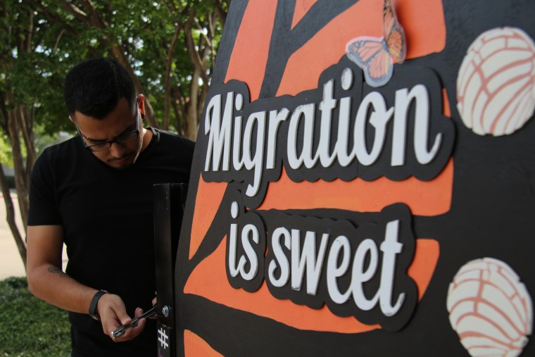 Jesus Valdez, a member of Jolt, a group focused on mobilizing young Latino voters, set up a sign outside a town hall with Democratic candidates on April 29, 2018, in Austin, Texas.