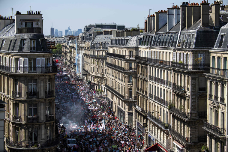 Image: Protesters fill a main thoroughfare during a rally against Macron
