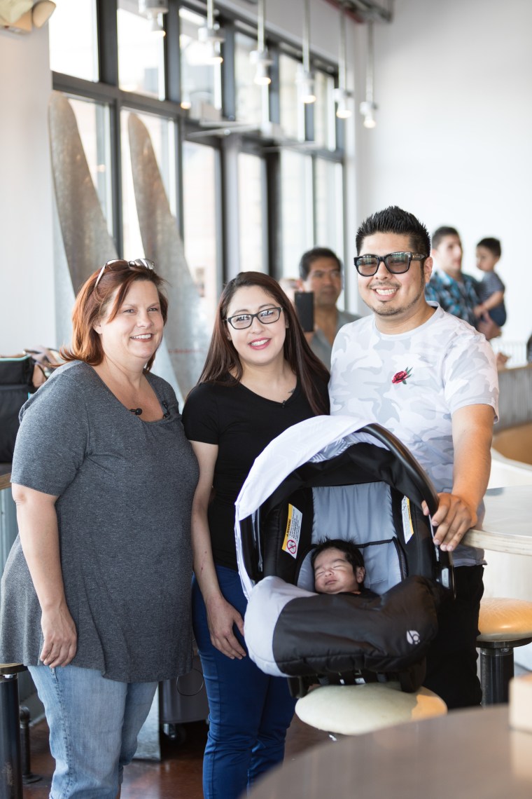 Adrianna Alvarez and Saul Flores with their son, Jaden, and Angie Schell, the 911 dispatcher who helped deliver their baby.