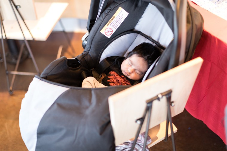 Baby Jaden, now four weeks old, sleeping at his Chipotle-themed baby shower.