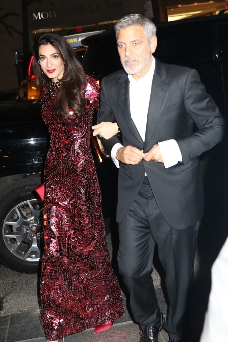 Amal Clooney and George Clooney attend the Heavenly Bodies: Fashion &amp; The Catholic Imagination Costume Institute Gala at The Metropolitan Museum of Art on May 7, 2018 in New York City.