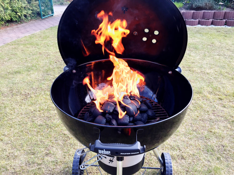 charcoal grill set up in a backyard