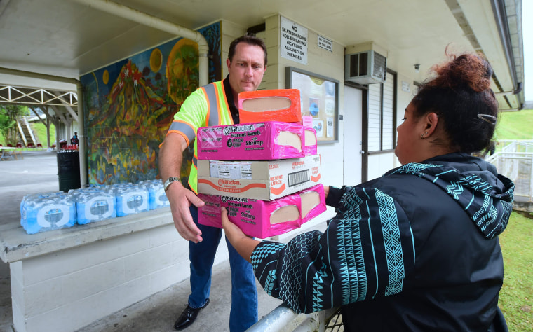 Image: Maurice Messina from the Parks and Recreation Department receives supplies donated to evacuees