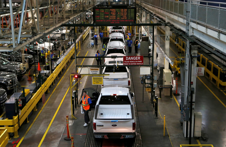 Image: Ford 2015 F-150 pickup trucks move down the final inspection line at the Ford Rouge Center in Dearborn