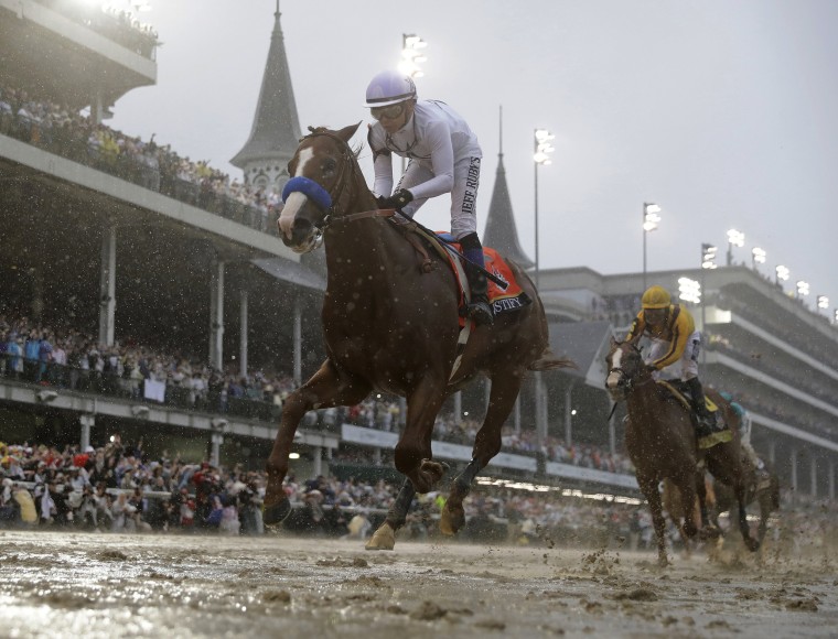 Image: Mike Smith rides Justify to victory during the 144th running of the Kentucky Derby