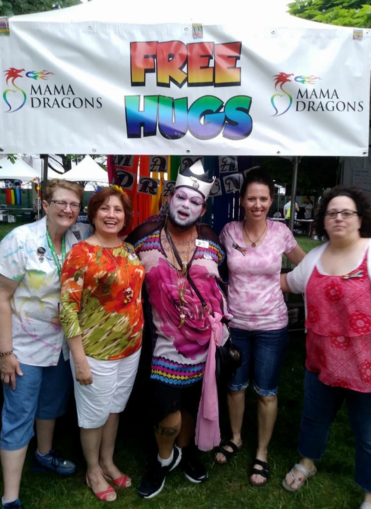 Image: Mama Dragons host a hugging booth during the 2017 Salt Lake City Pride festival.